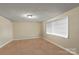 Simple bedroom with neutral walls and carpet at 2110 E Greenbriar Rd, Statesville, NC 28625