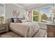 Bright bedroom with a comfortable bed and large windows at 3022 Loso Ter # 52, Charlotte, NC 28217