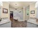 Elegant bathroom with double vanities, a walk-in shower, and marble flooring at 4364 Hager Mountain Ln, Iron Station, NC 28080