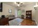 Cozy bedroom with hardwood floors and built-in shelving at 4364 Hager Mountain Ln, Iron Station, NC 28080
