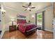 Comfortable bedroom with hardwood floors and a large window at 4364 Hager Mountain Ln, Iron Station, NC 28080