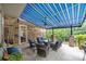 Relaxing patio features a striped awning, comfortable seating, and a heater at 4364 Hager Mountain Ln, Iron Station, NC 28080