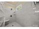 Spacious shower with glass block accents and built-in seat at 4364 Hager Mountain Ln, Iron Station, NC 28080