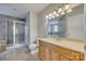 Main bathroom with soaking tub, shower, and wood vanity at 164 Quiet Cove Rd, Mooresville, NC 28117