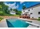 Large inground pool with diving board and plenty of room for relaxation at 164 Quiet Cove Rd, Mooresville, NC 28117