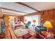 Living room with hardwood floors, comfy seating, and lots of natural light at 1405 Northcrest Dr, Albemarle, NC 28001