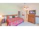 Spacious primary bedroom with a king-size bed and ensuite bathroom access at 1405 Northcrest Dr, Albemarle, NC 28001