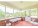 Screened porch with metal table and chairs at 1405 Northcrest Dr, Albemarle, NC 28001