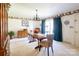 Bright dining area features a wooden table with teal curtains at 5911 Mooresville Rd, Salisbury, NC 28147