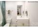 Clean bathroom with white vanity, toilet and shower/tub at 206 Giant Oak Ave, Statesville, NC 28677