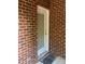 Exterior door leading to backyard; brick exterior wall at 19307 Beaufain St, Cornelius, NC 28031