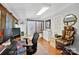 Bright home office with dual monitors, desk, and comfortable chair at 8018 Maxwelton Dr, Huntersville, NC 28078