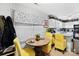 Bright dining area with yellow chairs and wood table at 8018 Maxwelton Dr, Huntersville, NC 28078