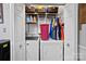 Laundry room with washer, dryer, and storage shelves at 8018 Maxwelton Dr, Huntersville, NC 28078