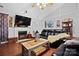 Cozy living room features a fireplace and a large TV at 8018 Maxwelton Dr, Huntersville, NC 28078