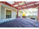 Covered back patio with pergola, providing shade and outdoor living space at 8018 Maxwelton Dr, Huntersville, NC 28078
