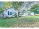 Charming ranch home with lush landscaping and a spacious yard at 8018 Maxwelton Dr, Huntersville, NC 28078