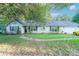 Ranch home with mature landscaping and a two-car garage at 8018 Maxwelton Dr, Huntersville, NC 28078