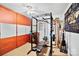 Well-equipped home gym with weight rack, bench, and storage at 8018 Maxwelton Dr, Huntersville, NC 28078