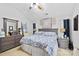 Spacious bedroom with large bed, dresser, and decorative wall art at 8018 Maxwelton Dr, Huntersville, NC 28078