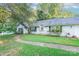 Simple yet elegant ranch home with a well-manicured lawn at 8018 Maxwelton Dr, Huntersville, NC 28078