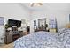 Bright bedroom featuring a large bed, TV, and built-in shelving at 8018 Maxwelton Dr, Huntersville, NC 28078