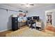 Functional home office featuring a corner desk and multiple monitors at 8018 Maxwelton Dr, Huntersville, NC 28078