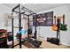 Home gym featuring weightlifting equipment and musical instruments at 8018 Maxwelton Dr, Huntersville, NC 28078
