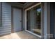 Private patio with sliding glass doors and storage at 18741 Nautical Dr # 101, Cornelius, NC 28031