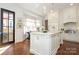 Bright kitchen with center island and black door at 348 S Laurel Ave, Charlotte, NC 28207