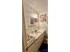 Bathroom with white vanity, double sinks, and white tile at 1206 Mineral Springs Rd, Charlotte, NC 28262