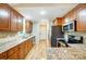 Open kitchen with stainless steel appliances and granite countertops at 2497 Carriage Ln, Lincolnton, NC 28092