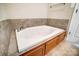 Bathroom with a large jetted tub and tile surround at 2497 Carriage Ln, Lincolnton, NC 28092