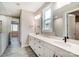 Double vanity bathroom with large mirror and walk-in shower at 3617 Marchers Trace Dr, Mint Hill, NC 28227