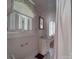 Clean bathroom with a shower/tub combo and classic vanity at 222 Leak Ave, Wadesboro, NC 28170