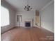 Bright dining room with hardwood floors and a fireplace at 222 Leak Ave, Wadesboro, NC 28170