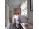 Simple bathroom includes toilet and shower at 222 Leak Ave, Wadesboro, NC 28170