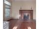 Living room with hardwood floors and fireplace at 222 Leak Ave, Wadesboro, NC 28170