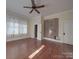 Bright bedroom featuring hardwood floors and a unique wall at 222 Leak Ave, Wadesboro, NC 28170