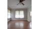 Large bedroom with hardwood floors and access to bathroom at 222 Leak Ave, Wadesboro, NC 28170
