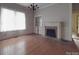 Spacious dining room featuring hardwood floors and a fireplace at 222 Leak Ave, Wadesboro, NC 28170