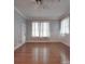 Well-lit bedroom featuring hardwood floors and window at 222 Leak Ave, Wadesboro, NC 28170