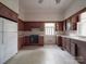Kitchen with wood cabinets, appliances, and patterned floor at 222 Leak Ave, Wadesboro, NC 28170