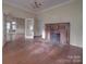 Living room with hardwood floors and fireplace at 222 Leak Ave, Wadesboro, NC 28170