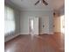 Bright bedroom with hardwood floors and multiple doors at 222 Leak Ave, Wadesboro, NC 28170