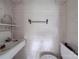 Small bathroom with old sink, toilet, and towel rack at 222 Leak Ave, Wadesboro, NC 28170
