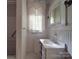 Bathroom with vanity, shower, and window at 222 Leak Ave, Wadesboro, NC 28170
