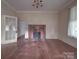 Living room with hardwood floors and fireplace at 222 Leak Ave, Wadesboro, NC 28170