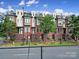 Row of modern townhouses with brick exteriors and rooftop decks at 701 N Church St # 3, Charlotte, NC 28202