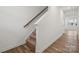 Carpeted staircase with wooden handrail and light flooring at 723 Olde England Dr, Lincolnton, NC 28092